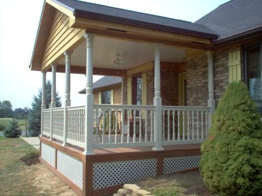 Custom Archadeck open front porch with Fiberon composite decking, Veka vinyl rails and lattice skirting in New Lebanon Ohio