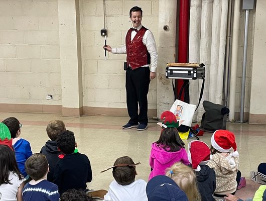 Magic Evan mesmerizing kids at our co-op holiday party