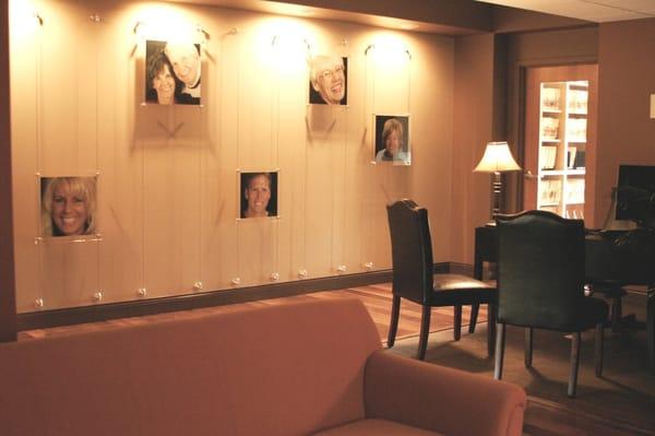 Photos of smiles created by Really Smile adorn the walls of the entrance area