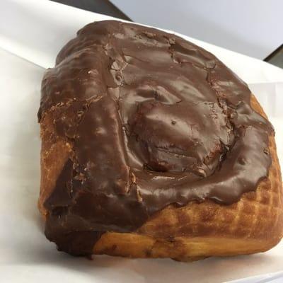 Cinnamon Bun topped with Chocolate frosting.