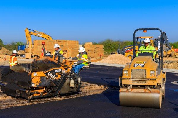 Asphalt paving crew in Round Rock, TX.