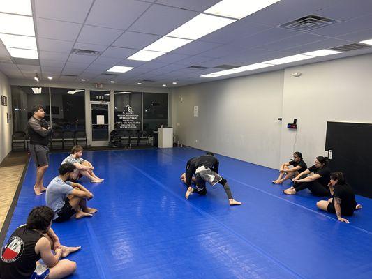 Demonstrating the technique to our adult No-go Brazilian Jiu-Jitsu class.