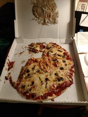 Pizza was just delivered and this is the condition (minus some pieces that had to be eaten). The taste was mediocre.