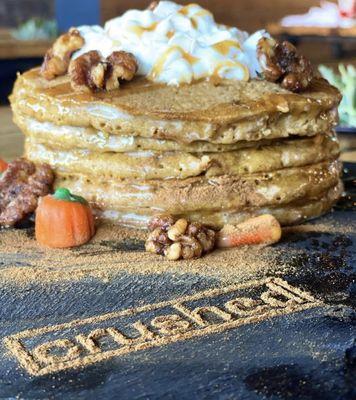 Pumpkin  Pancakes 
A stack of 6 mini fresh pumpkin pancakes topped with whipped cream, candied walnuts and drizzled in caramel sauce.