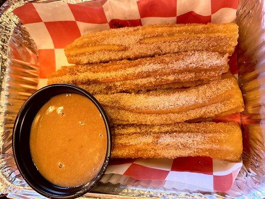 Churros with caramel sauce.