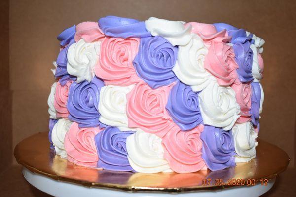 Strawberry Cake with colorful rosettes.