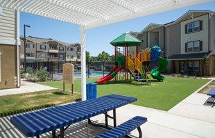 Sparkling pool, playground and picnic area.