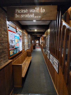 The long long corridor hallways usually jam-packed with people waiting especially on the weekends and dinner hour