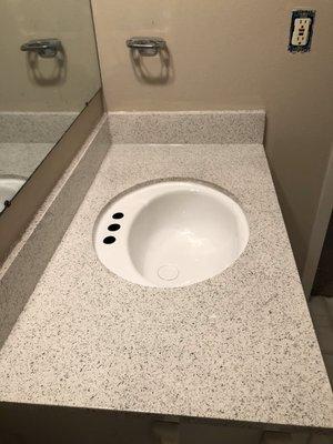 Refinish countertop (multicolor) with a white refinish sink.