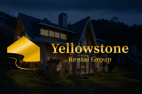 a dark photo picturing a beautiful house with Yellowstone Rental Group logo in gold