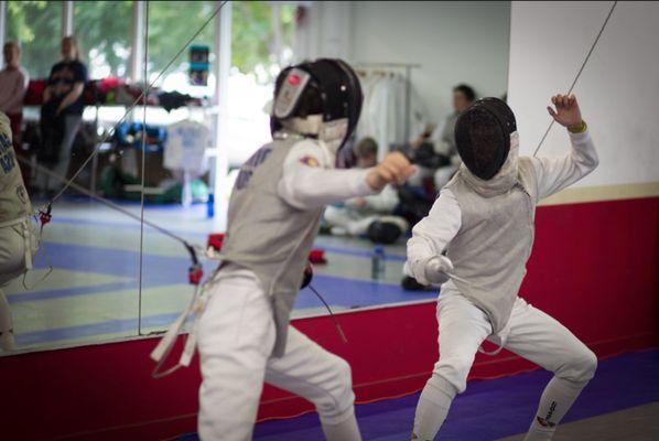 Bout during one of the tournaments hosted at the United Fencing Academy