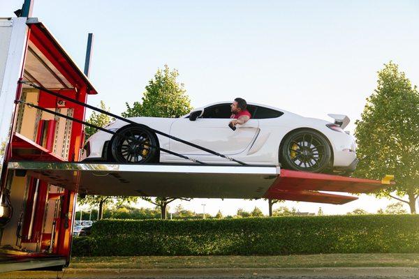 Ship A Car ASAP
Porsche being loaded in an enclosed trailer.