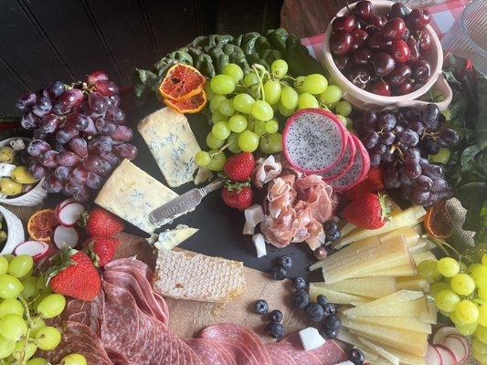 Close up of a Medium mixed Charcuterie and Specialty Cheese Board