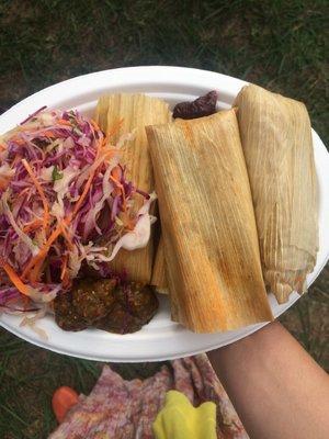 Four tamales with slaw and two of the sauces (the verde and the Rojas).