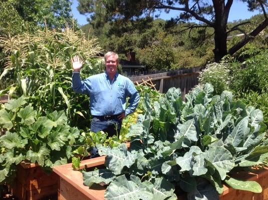 Eric Rayner enjoys one of the edible gardens built by his company for a famous chef.