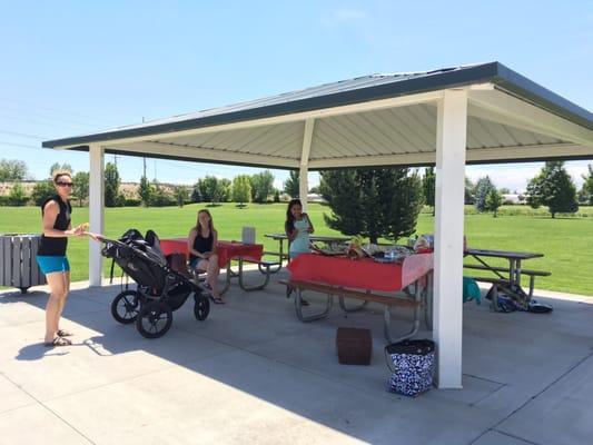 4 covered picnic tables right next to the park