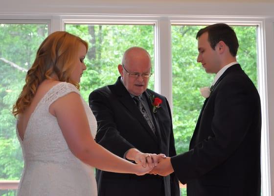 Grandpa praying over the couple before announcing them married.