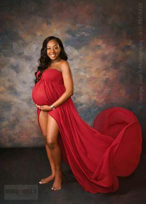 Mother-to-be in a red maternity gown.