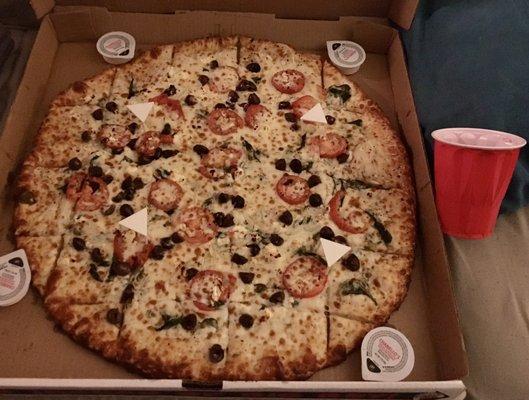 20" Big Boy Alexander the Greek Pizza with extra Greek olives; solo cup for size comparison