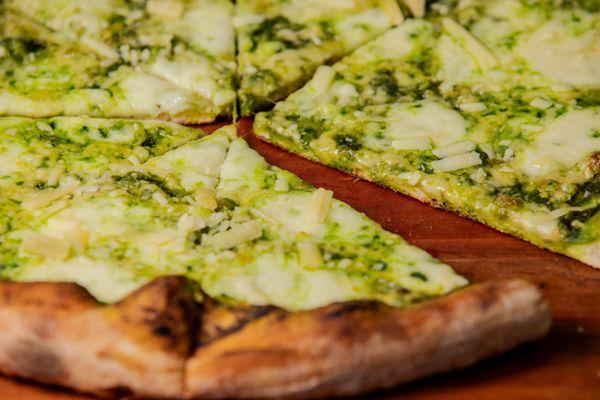 Francesco Pizza Slice.
Fresh basil pesto, mozzarella, grated parmigiano.