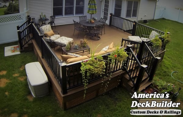 All earthtones beg the gardener on this Trex deck creation with composite railing in Barnegat, New Jersey.