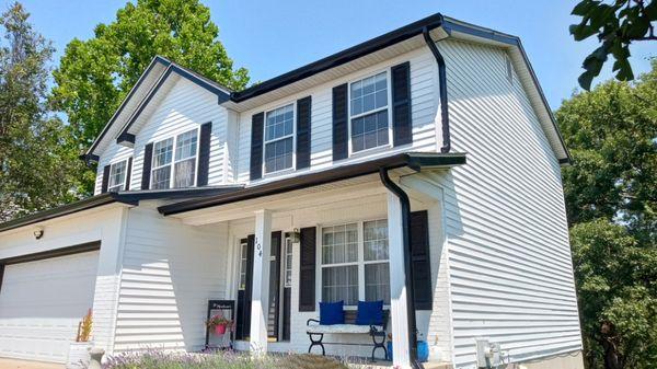 New Class 4 Impact Resistant Roof, New Siding, Custom bent black metal Fascia, and upgraded 6" gutters to match.