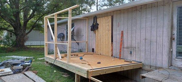 In the process of rebuilding back porch with screen room an metal roof