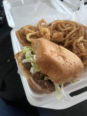 Fully dressed cheeseburger with onion rings