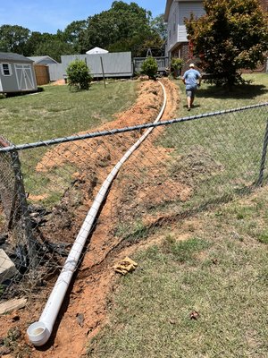 Drainage pipe running out to end of road