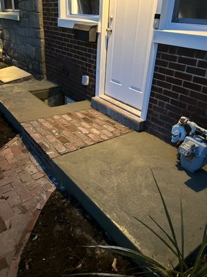 Custom sidewalk with brick inlay