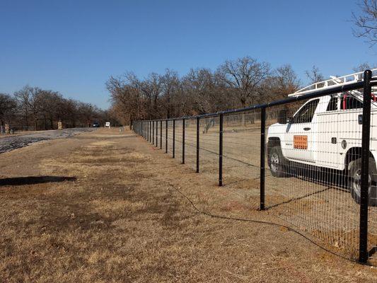 Pipe fence with no climbing wire.