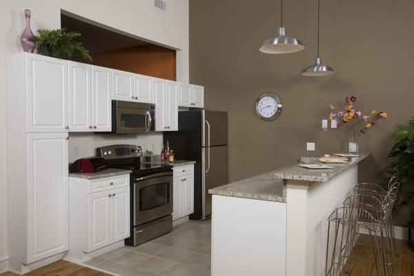 Modern, Clean Kitchens with Stainless Steel Appliances, Ceramic tile floors and granite counters