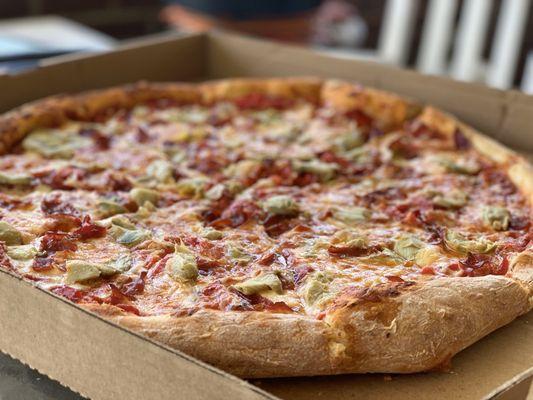 This was a large pizza with capicola, artichokes and roasted red peppers. We haven't had such a good pizza in a long time.