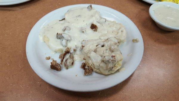 Biscuits and gravy ($2.69) plus sausage ($.81) for a TOTAL of $3.50. Menu is misleading.  AWESOME and huge portion!