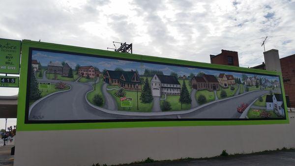 The mural on the side of the Signature Properties Office building.