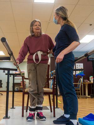 Resident receiving physical therapy