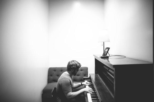 Philip writing his next tune in the piano room