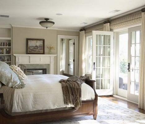 Woven wood shades in a master bedroom