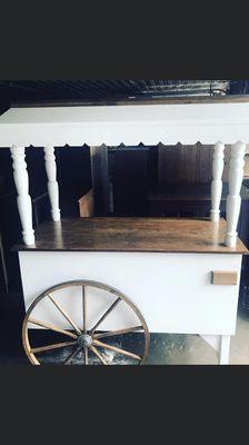 6ft antique white cart that can be used for your candy of choice, popcorn or mini desserts .