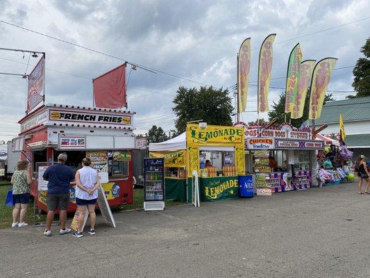 Some people f the many food vendors at the Canfield Fair