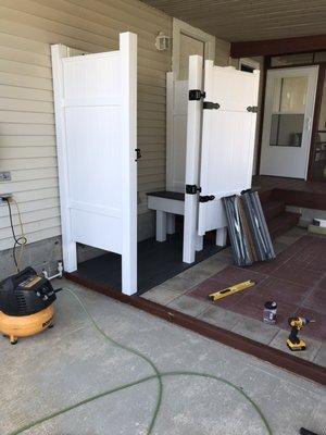 Outdoor shower with a bench