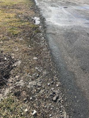 No edge to the driveway to control the water washout that will occur.