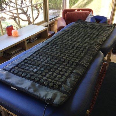 Ask to warm your body to the core with this heating pad made with healing jade stones.