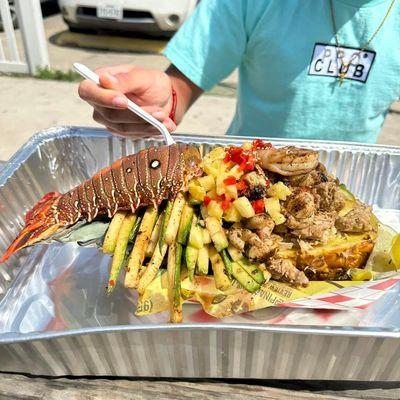 The famous big Baller bowl, half pound lobster half pound chicken massive amount of zucchini, grow fries and a jumbo grilled shrimp!