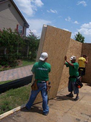 Crew setting a wall panel