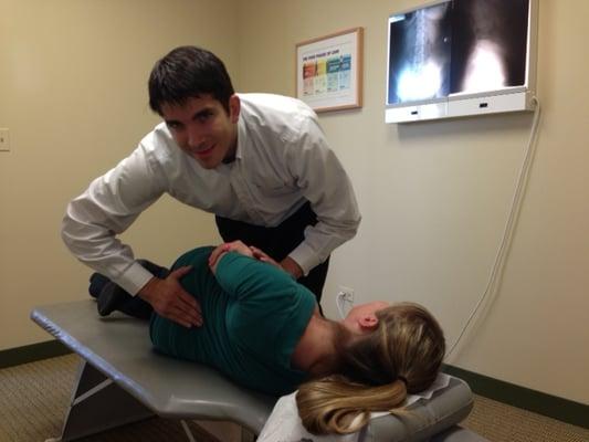 Dr. Leao performing a chiropractic adjustment