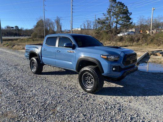 Repaired blue Toyota Tacoma