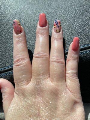 Crooked nails and color is not smooth nor consistent on the nails.