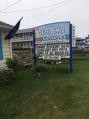 The cottages are located along a long strip of beach motels