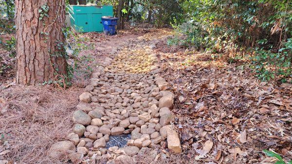 Installed dry stream bed with catch basin